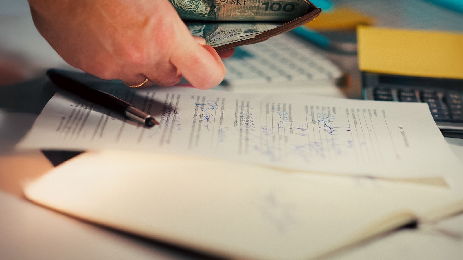 Person reviewing a household budget after losing a job.